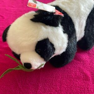Panda stuffed animal eating bamboo leaf. with tag. aurora brand